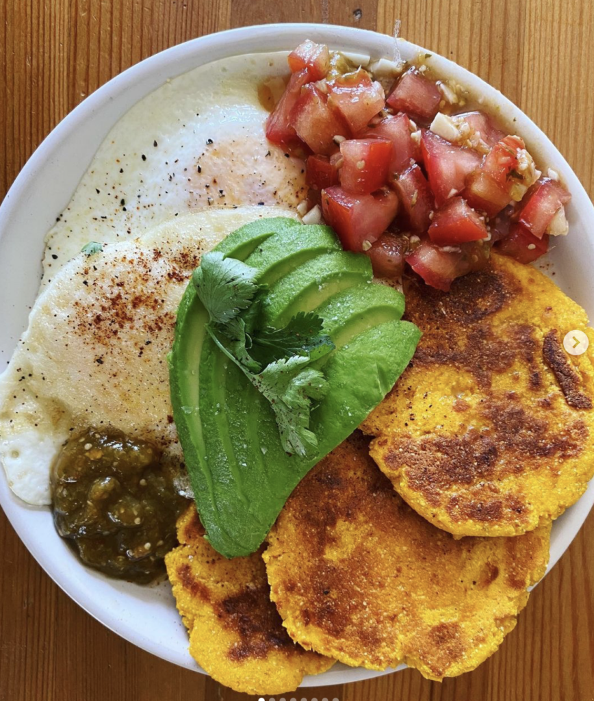 Kabocha sopes on a plate with eggs, avocado, and salsa